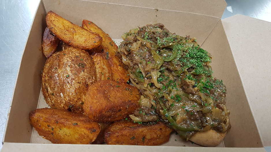 Box of Philly Cheesesteak and Cajun Wedges