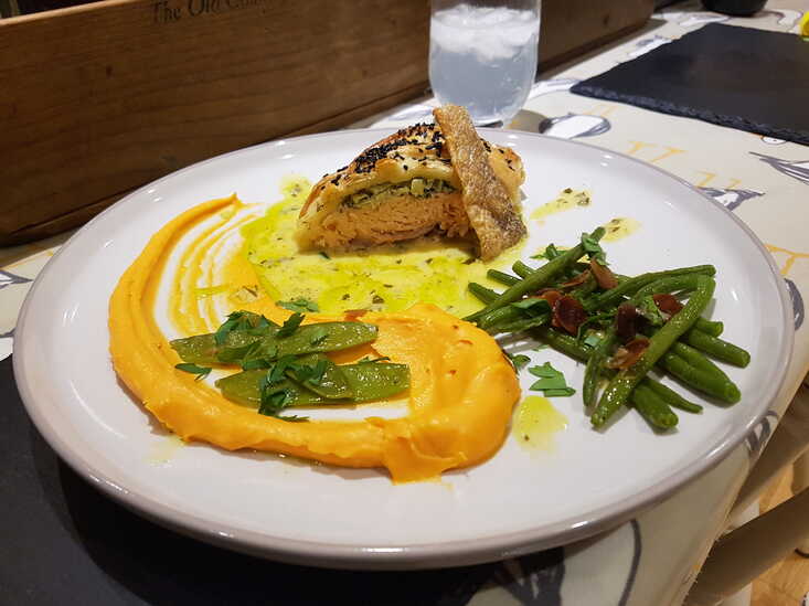 Salmon en Croûte with Green Beans and Almonds, Sweet Potato Purée, Lemon Butter Sauce split with Basil Oil, Crispy Salmon Skin.