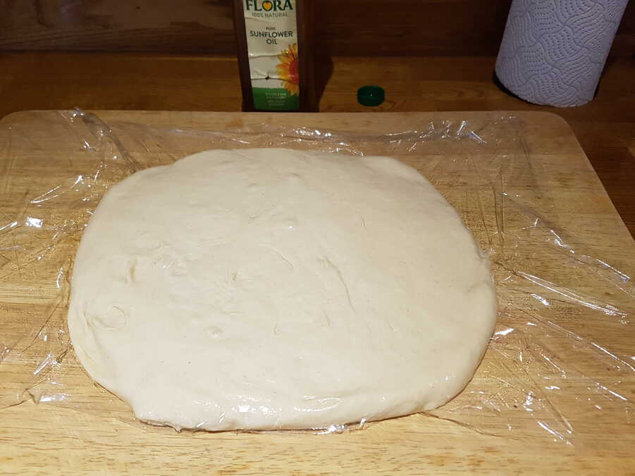 Karl's dough spread out for proving.