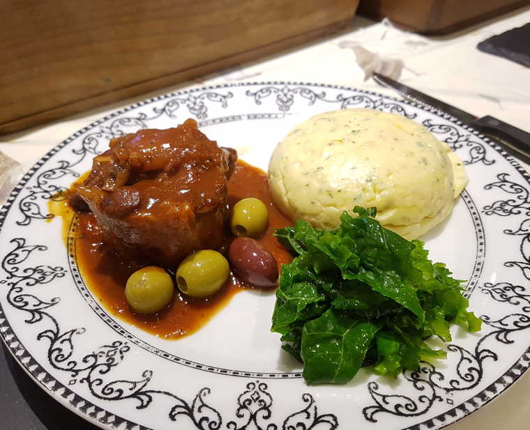 Oxtail Stew with Kalamata Olives, Mint & Lime Polenta, Kale with Herb Oil