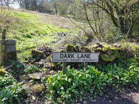 'Dark Lane' street sign