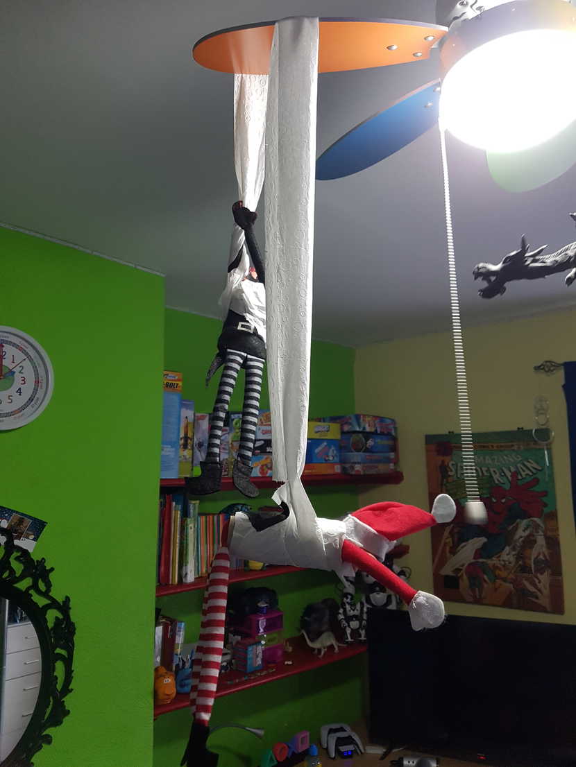 Mischievous Elves Decorating George's Ceiling Fan with Toilet Paper