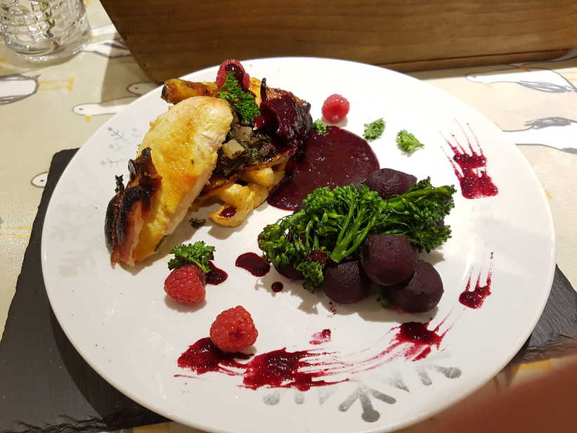 Roast Poussin Stufed with Black Pudding and Apple. Served with Celeriac Chips, Liquorice Beetroot, Tenderstem Broccoli and Raspberry, Beetroot and Red Wine Sauce