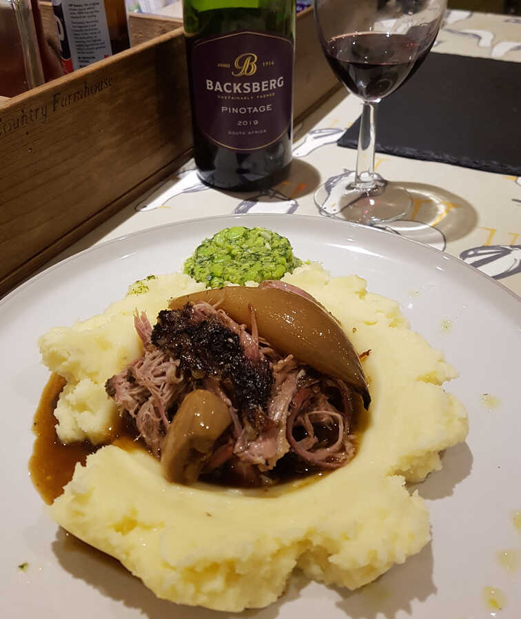 Lamb Shoulder served on Parmesan Crème Fraîche Mash with Mashed Broad Beans.