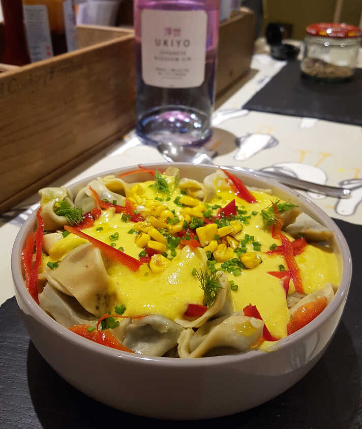 Sweetcorn Velouté with Globe Artichoke Hearts over Spinach and Mascarpone Tortellinis.