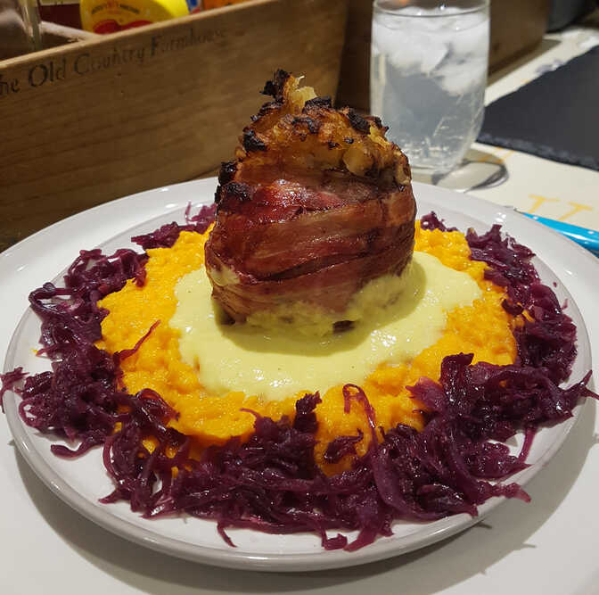 Cider and Apple Stuffed Pigs Heart with Orange-Leek Sauce, Mashed Sweet Potato with Apricots, and Cider-Braised Red Cabbage.