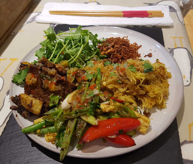 Lemongrass and Pineapple Stir-Fried Beef. Vermicelli. Stir-Fired Vegetables. Crispy Shallots and Crushed Roast Peanuts. Coriander and Pea Shoots.